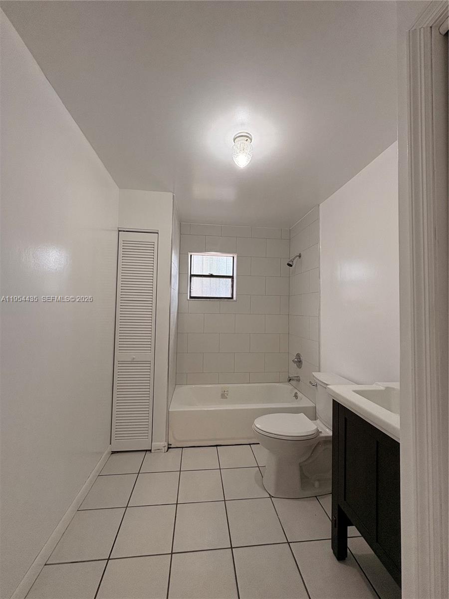 2390 Northwest 30th Street Miami, FL 33142 - Photo 13 of 14 a bathroom with a sink a toilet and shower