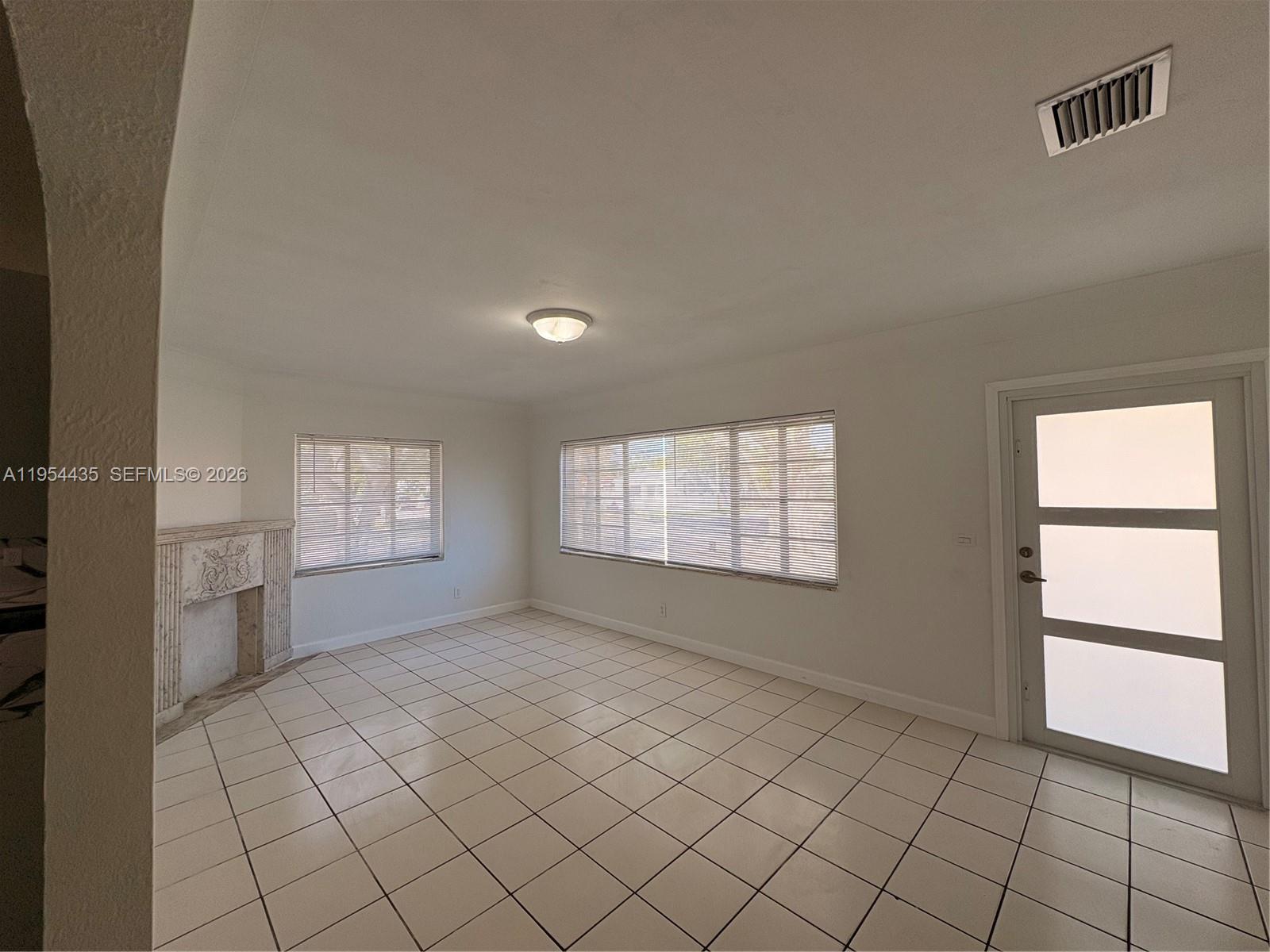 2390 Northwest 30th Street Miami, FL 33142 - Photo 2 of 11 a view of an empty room and window