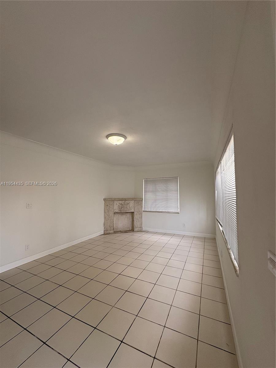 2390 Northwest 30th Street Miami, FL 33142 - Photo 2 of 14 a view of an empty room and window