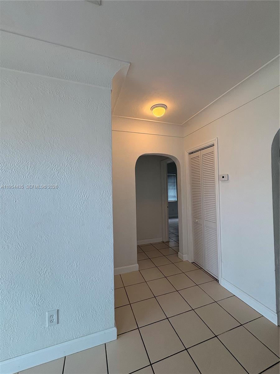 2390 Northwest 30th Street Miami, FL 33142 - Photo 6 of 14 a view of a livingroom with wooden floor