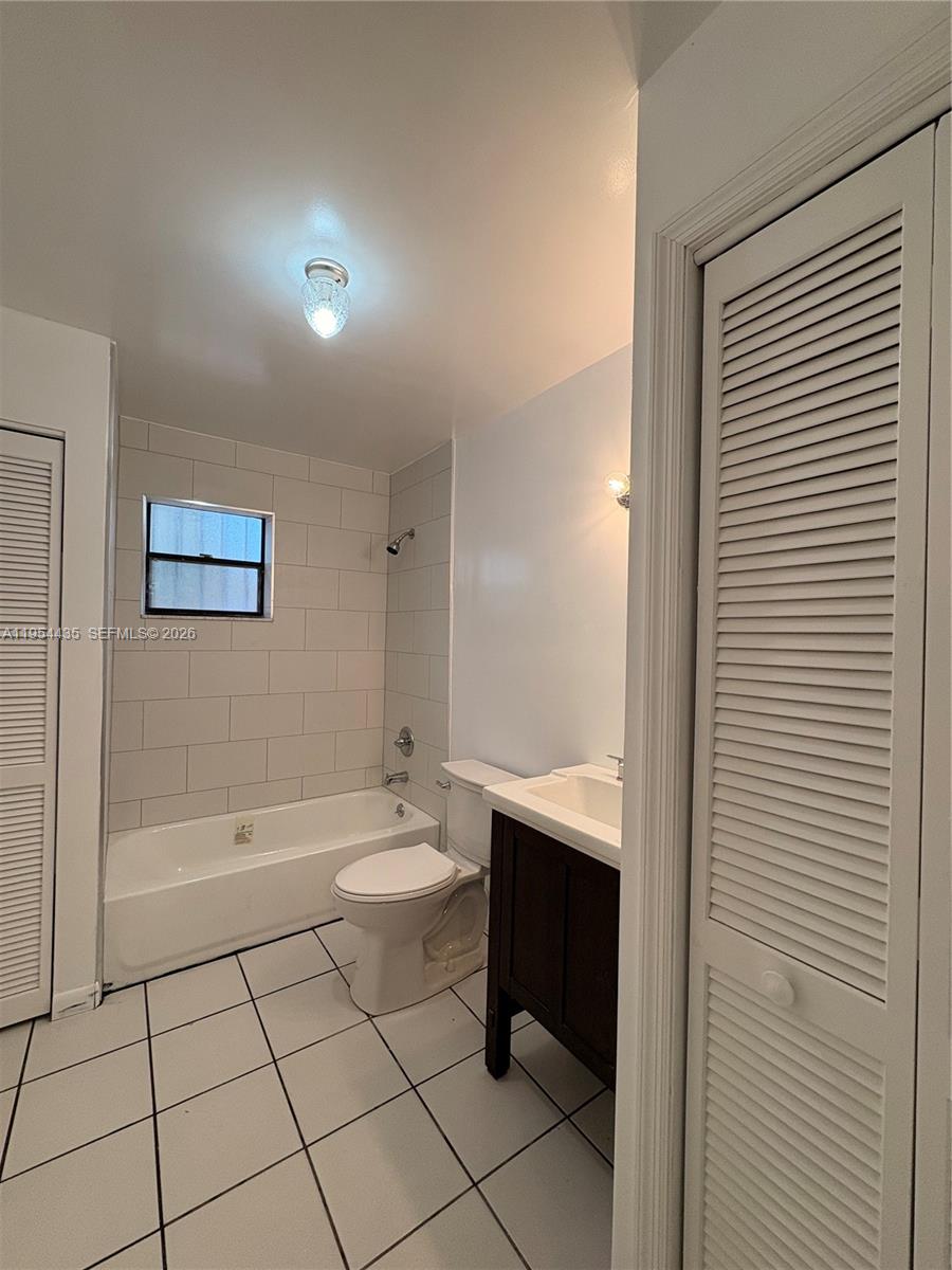 2390 Northwest 30th Street Miami, FL 33142 - Photo 10 of 11 a bathroom with a toilet a sink and bathtub