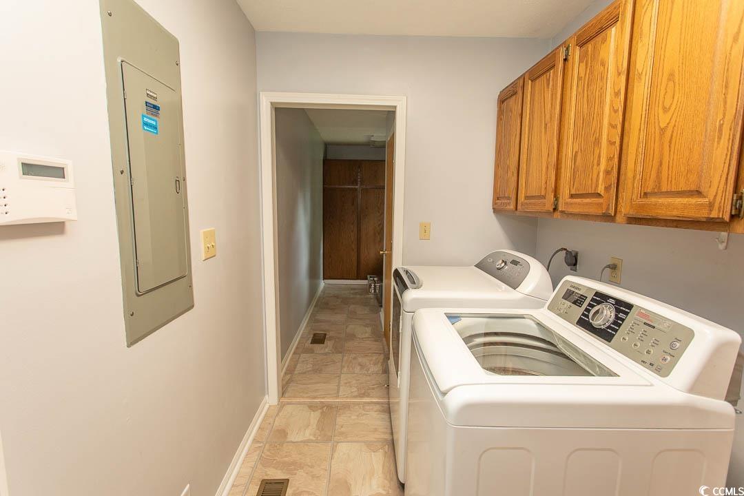 18 Pine Valley Lane Surfside Beach, SC 29575 - Photo 18 of 35 Washroom featuring cabinet space, washer and dryer, electric panel, and baseboards