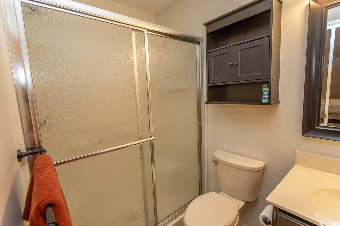 18 Pine Valley Lane Surfside Beach, SC 29575 - Photo 24 of 35 Bathroom with vanity, toilet, and a stall shower