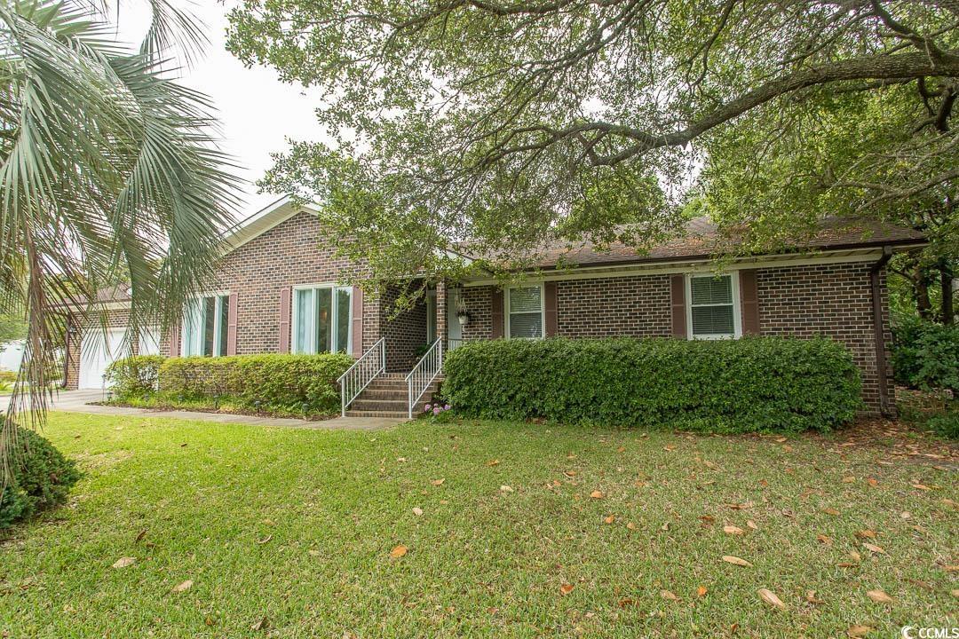 18 Pine Valley Lane Surfside Beach, SC 29575 - Photo 28 of 35 View of front of home featuring brick siding and a front lawn