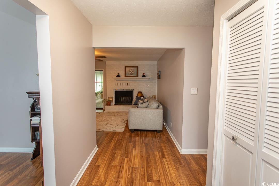 18 Pine Valley Lane Surfside Beach, SC 29575 - Photo 7 of 35 Hallway featuring wood finished floors and baseboards