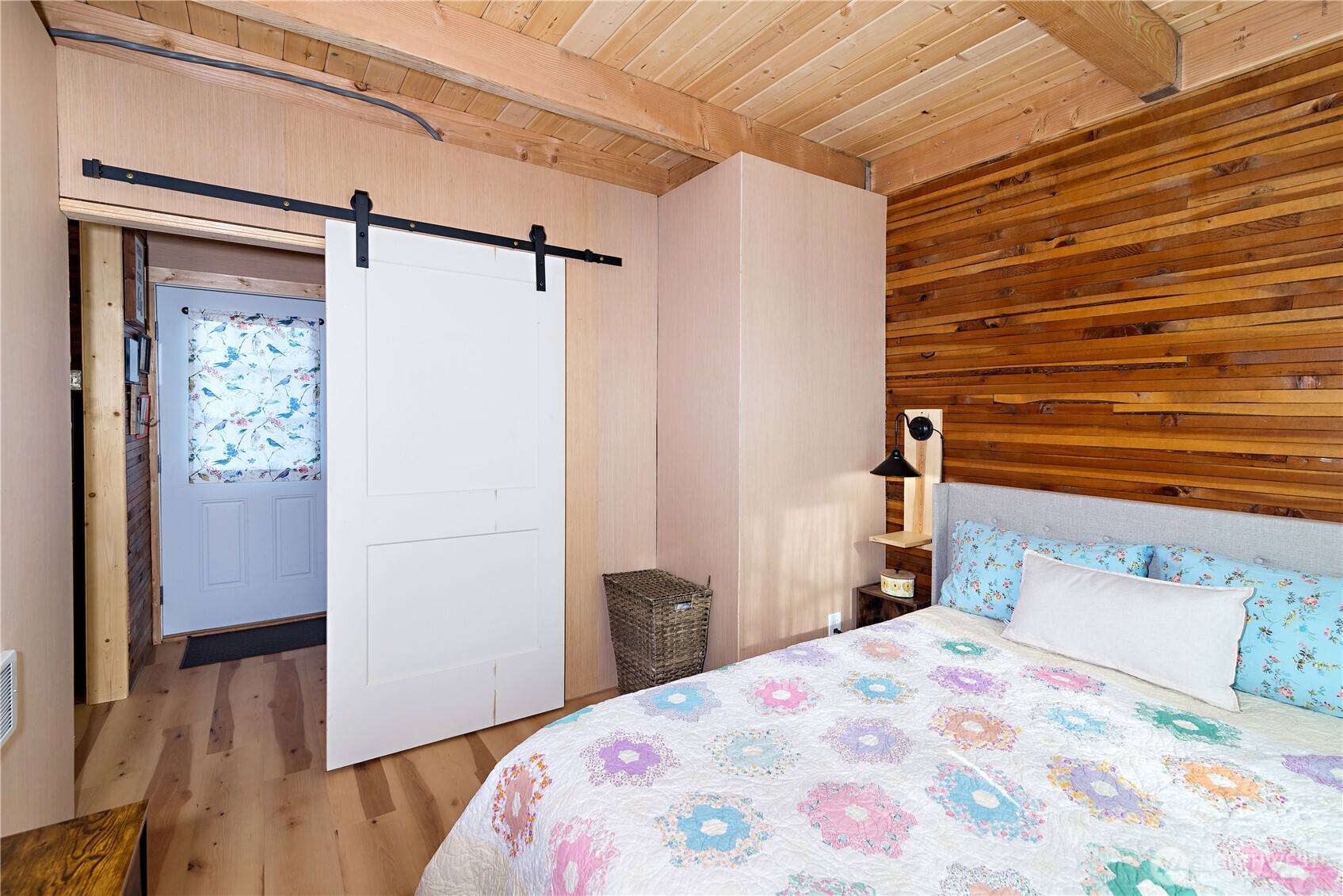 5920 4th Parallel Road Ellensburg, WA 98926 - Photo 21 of 30 a bedroom with a bed and wooden floor