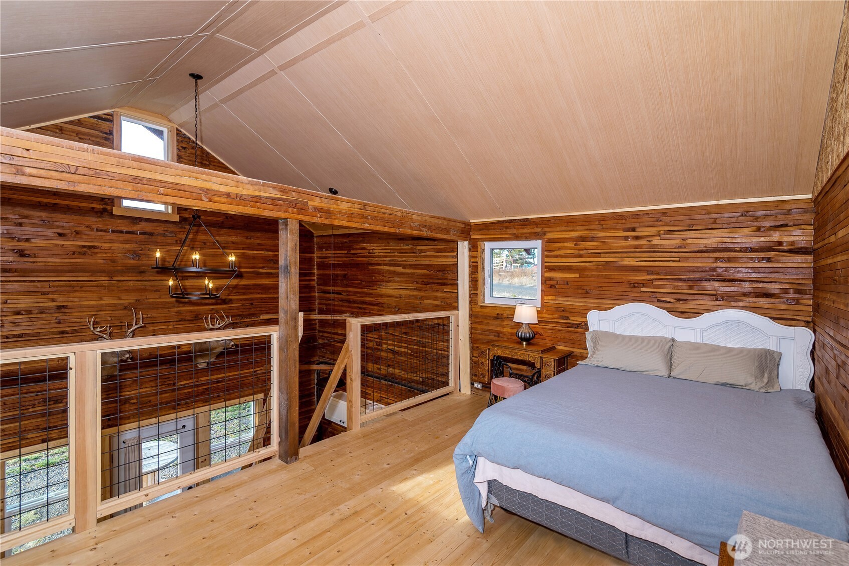 5920 4th Parallel Road Ellensburg, WA 98926 - Photo 22 of 30 a bedroom with a bed and wooden floor