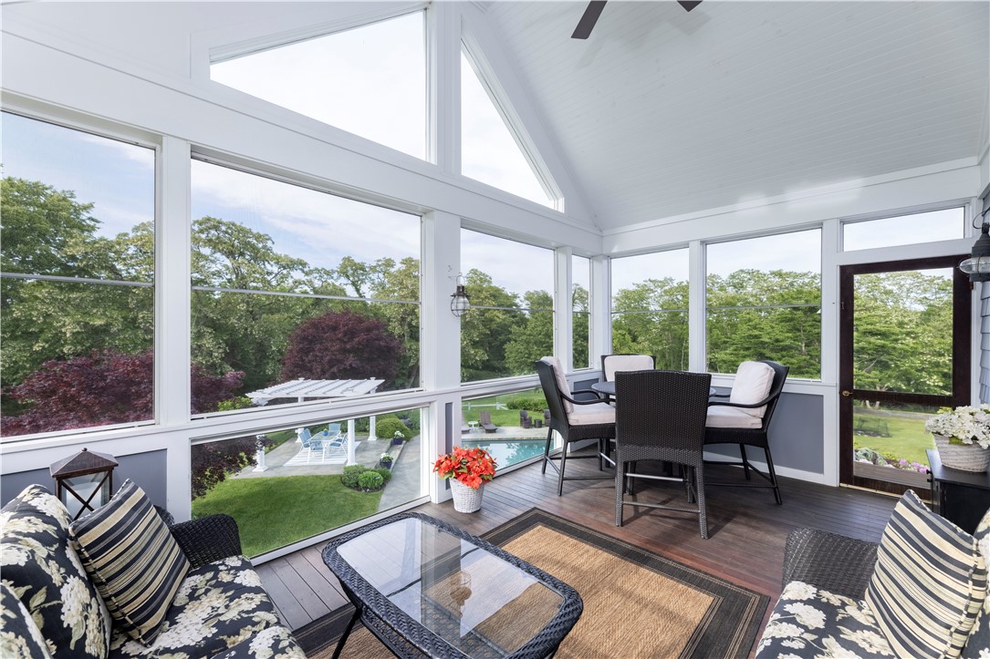15 Reliance Drive Bristol, RI 02809 - Photo 15 of 38 Screened in Porch with pool and woodland views