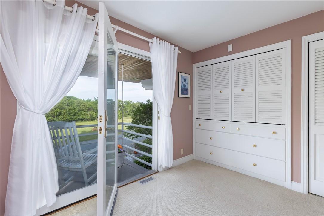 15 Reliance Drive Bristol, RI 02809 - Photo 19 of 38 Primary suite with wall of built in dressing cabinets