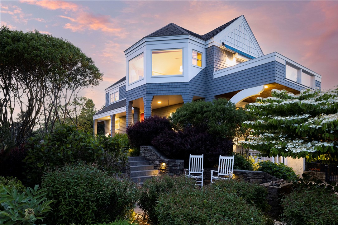 15 Reliance Drive Bristol, RI 02809 - Photo 33 of 38 Stone patio in the garden at twilight