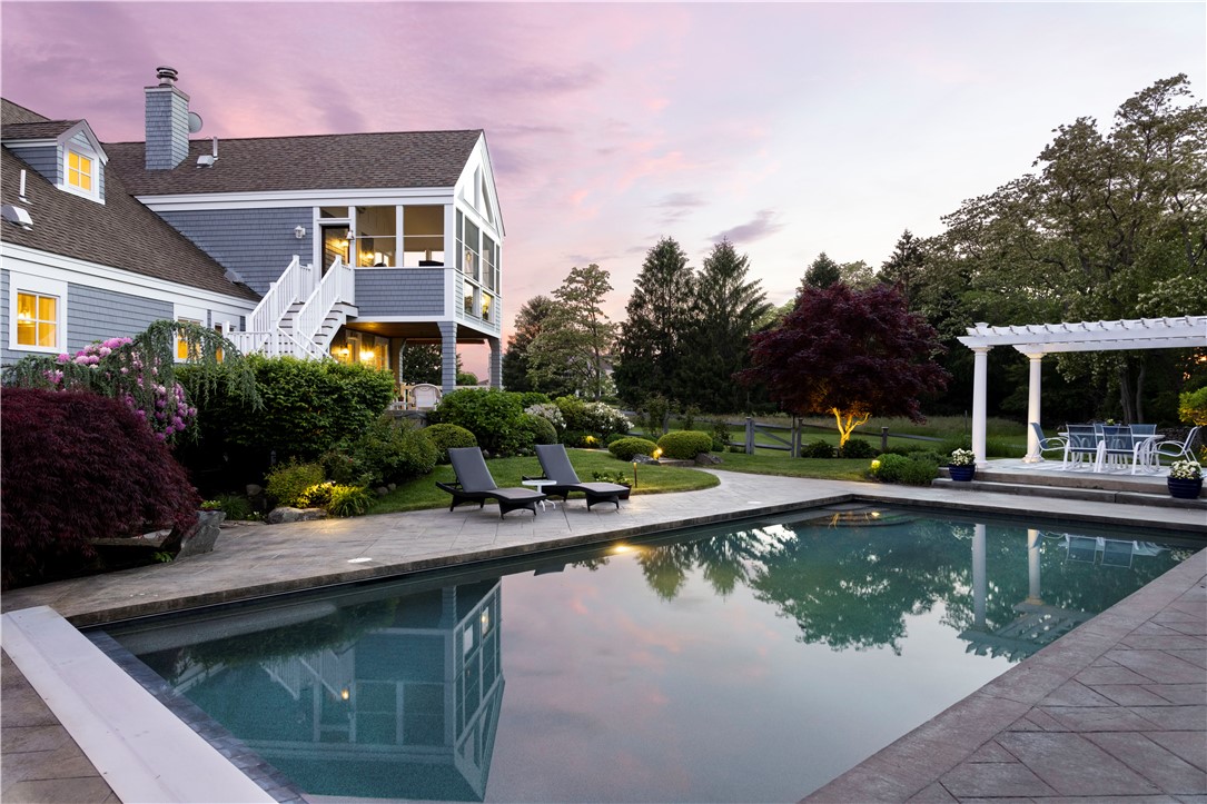 15 Reliance Drive Bristol, RI 02809 - Photo 34 of 38 The pool at sunset with custom lighting