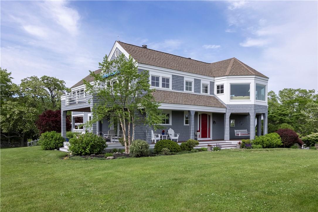 15 Reliance Drive Bristol, RI 02809 - Photo 5 of 38 Front of house showing three of the seven porches