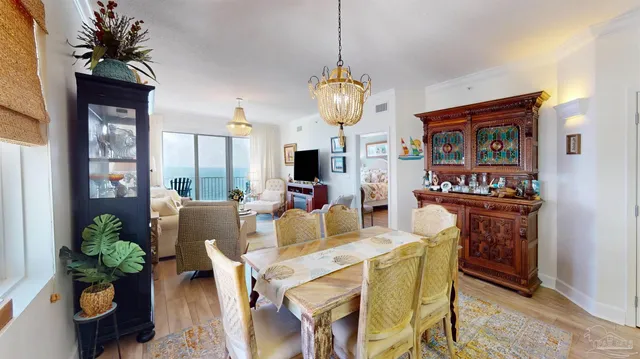 a bedroom with bed and a chandelier