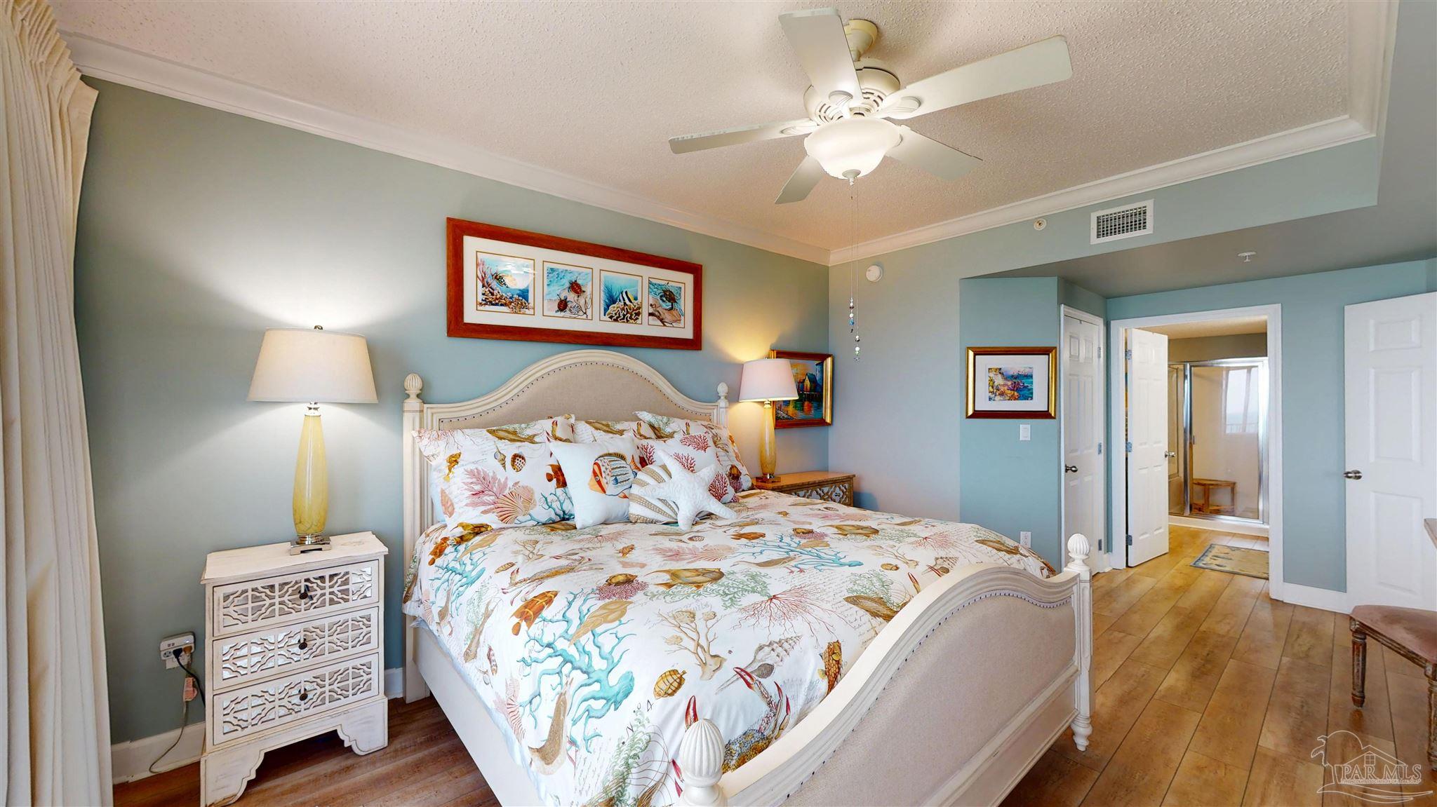 14511 Perdido Key Drive, Unit 1301 Perdido Key, FL 32507 - Photo 27 of 65 a bedroom with bed and a chandelier