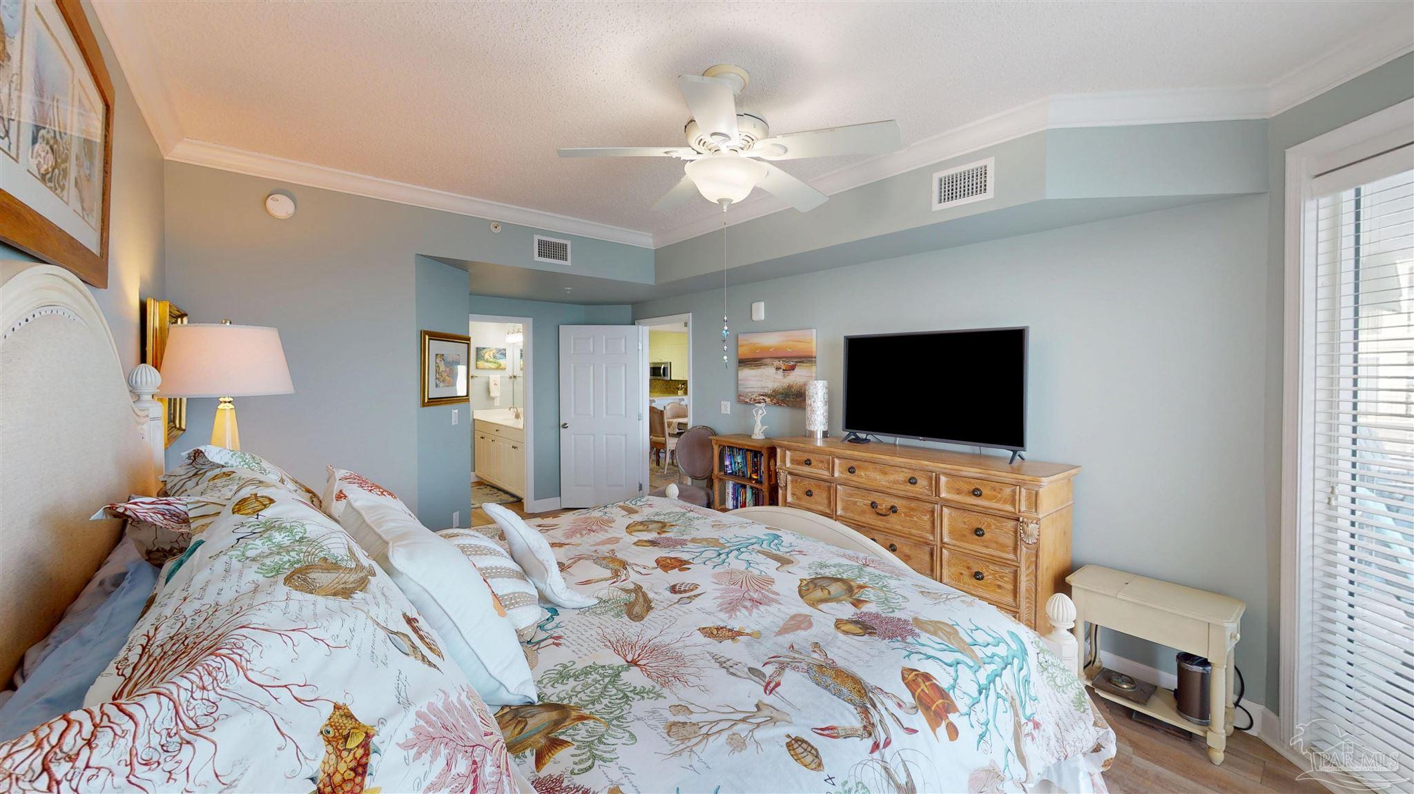 14511 Perdido Key Drive, Unit 1301 Perdido Key, FL 32507 - Photo 30 of 65 a bedroom with a bed and a flat screen tv