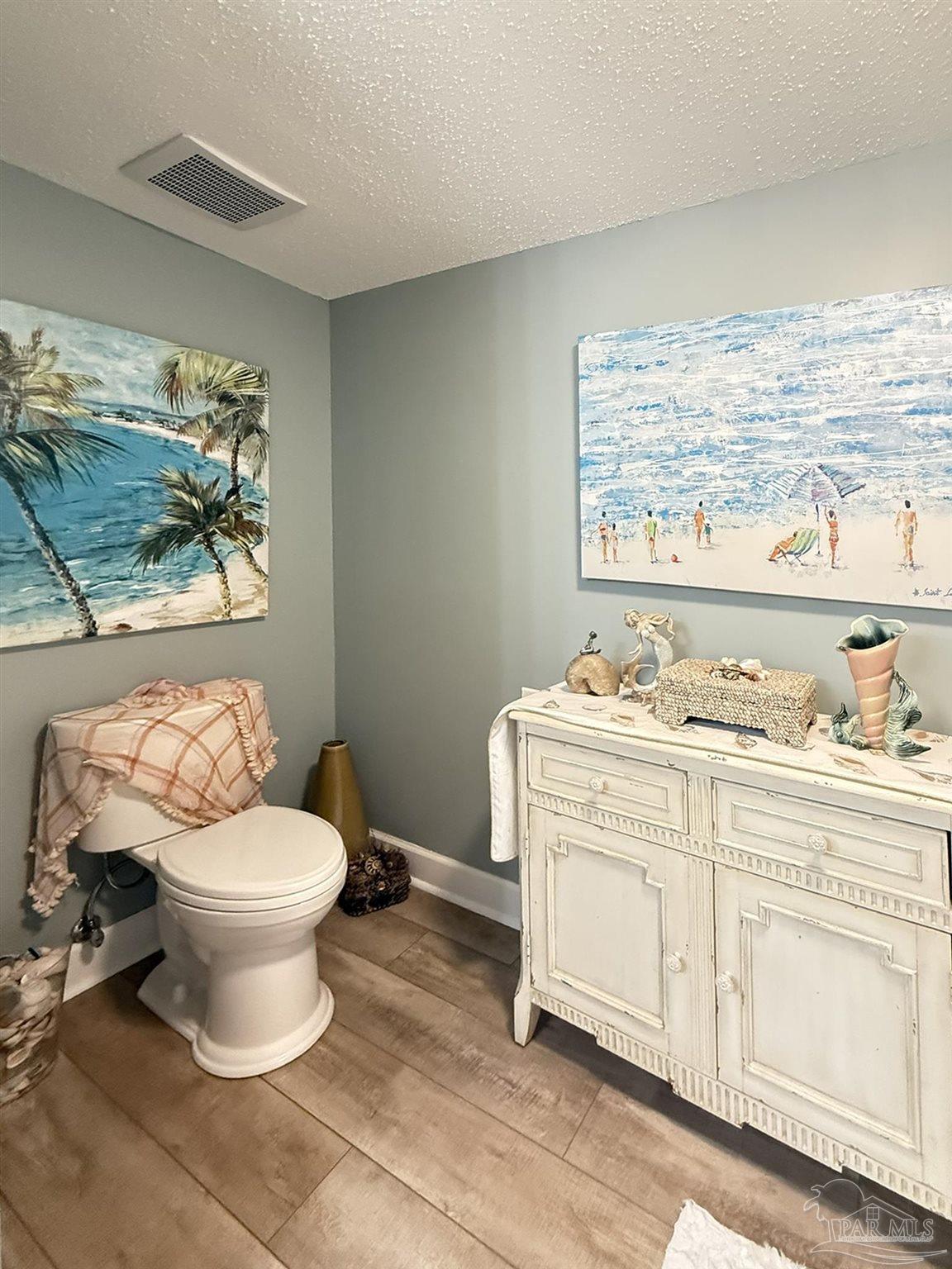 14511 Perdido Key Drive, Unit 1301 Perdido Key, FL 32507 - Photo 35 of 65 a bathroom with a toilet sink and mirror