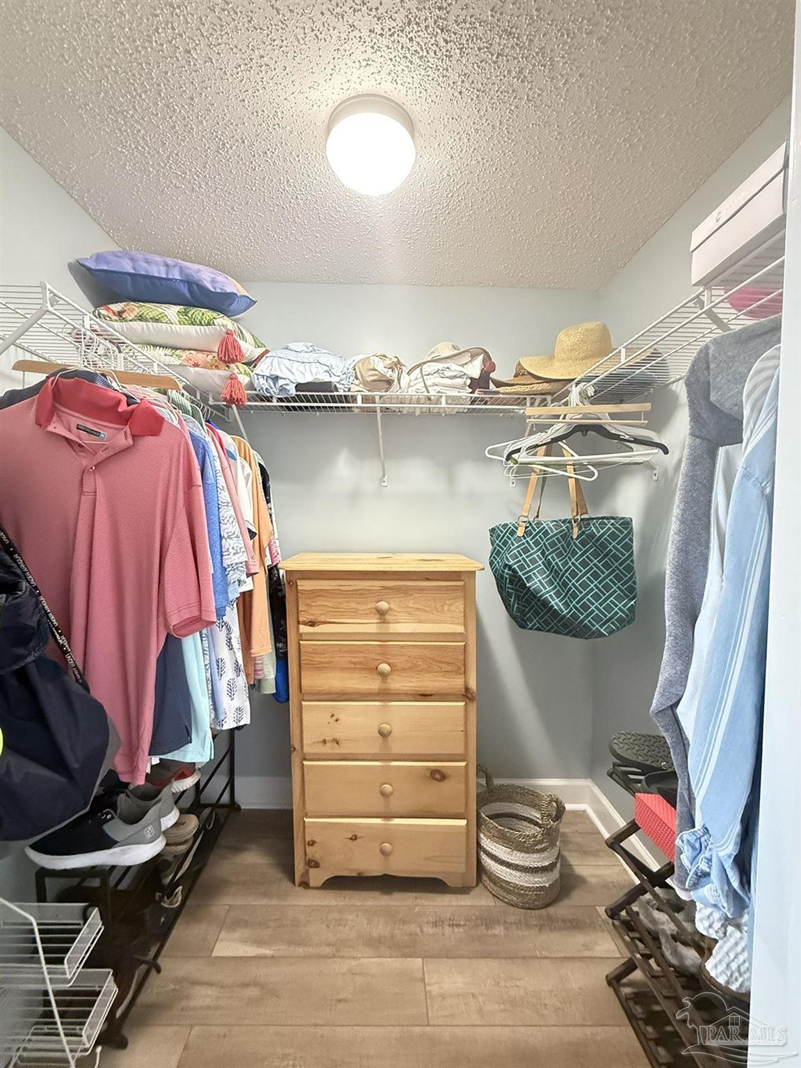 14511 Perdido Key Drive, Unit 1301 Perdido Key, FL 32507 - Photo 36 of 65 a view of walk in closet with clothes and shoes
