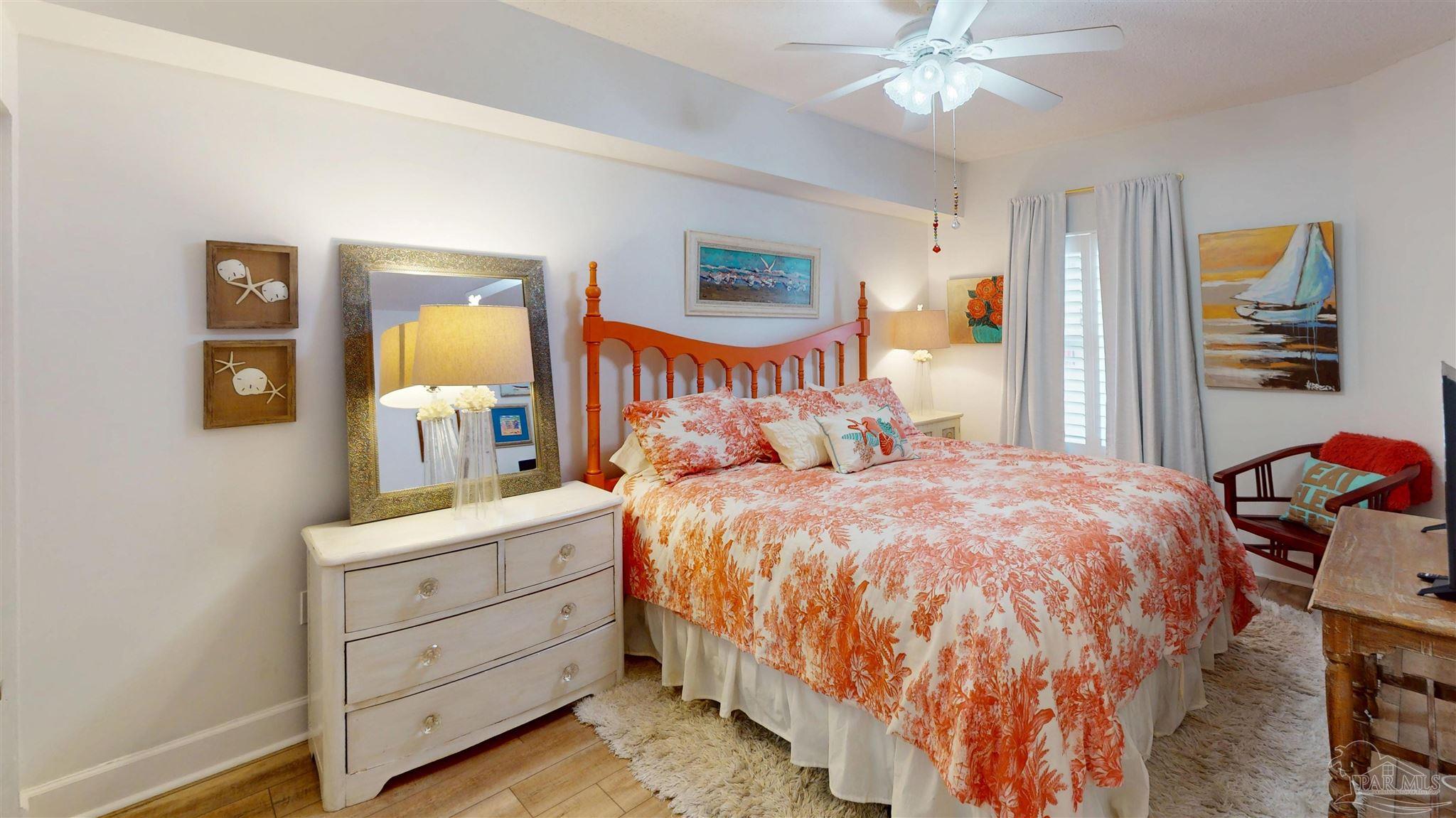 14511 Perdido Key Drive, Unit 1301 Perdido Key, FL 32507 - Photo 38 of 65 a bedroom with a bed and a chandelier