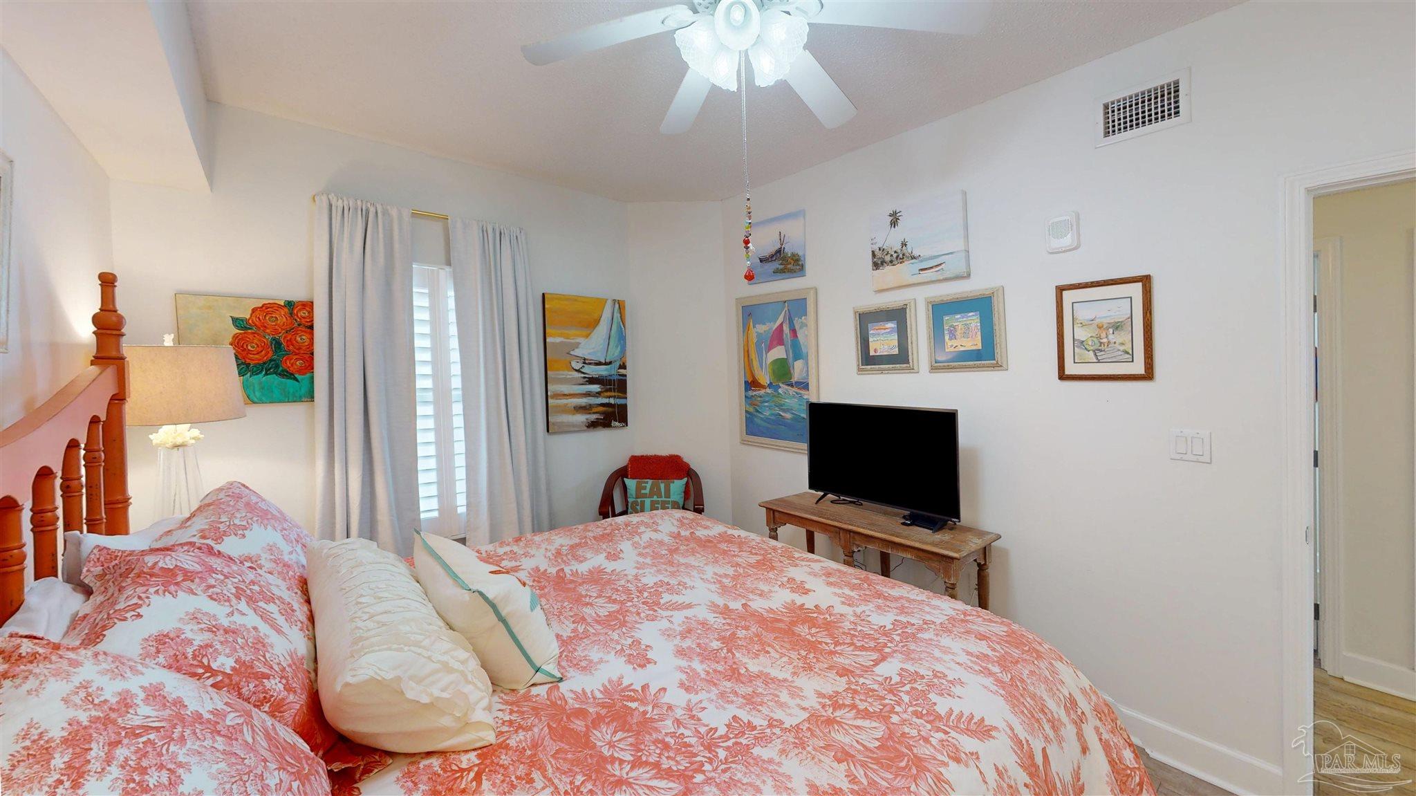 14511 Perdido Key Drive, Unit 1301 Perdido Key, FL 32507 - Photo 39 of 65 a bedroom with a bed and a flat screen tv