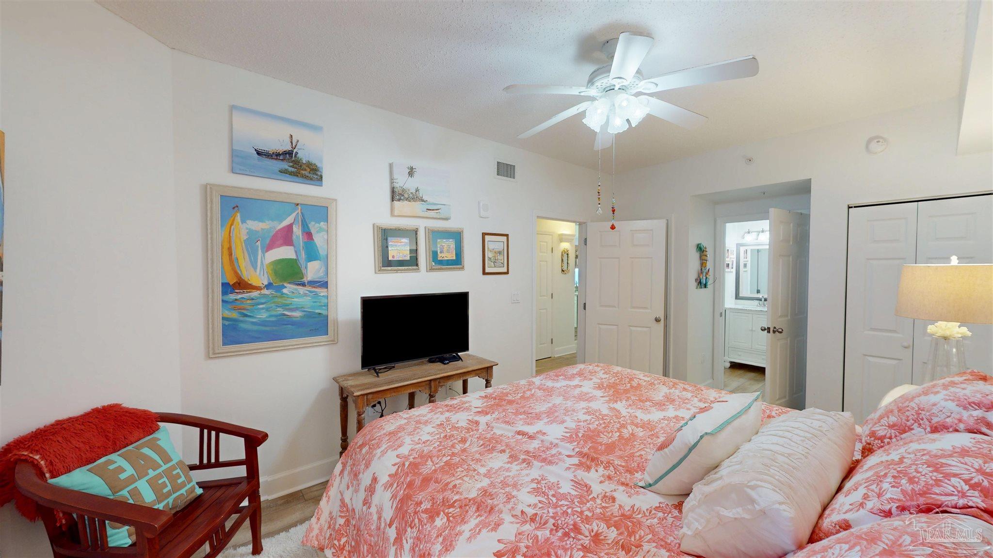 14511 Perdido Key Drive, Unit 1301 Perdido Key, FL 32507 - Photo 40 of 65 a bedroom with a bed and a flat screen tv