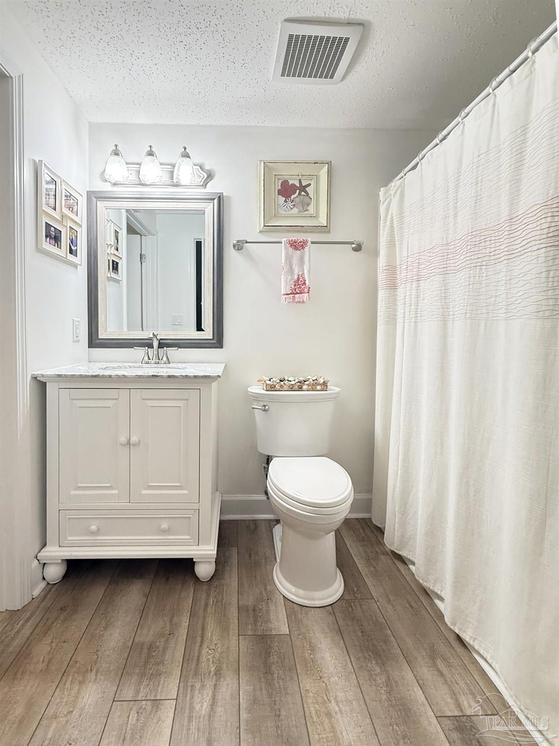 14511 Perdido Key Drive, Unit 1301 Perdido Key, FL 32507 - Photo 41 of 65 a white toilet sitting next to a bathroom sink