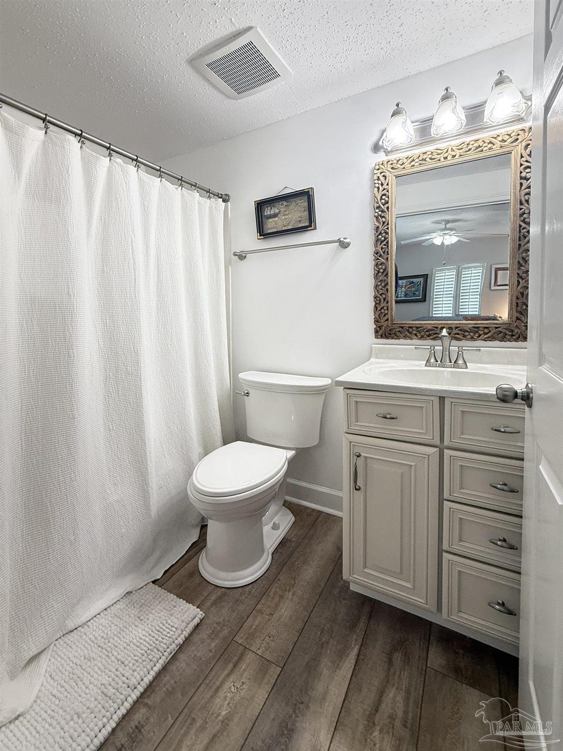 14511 Perdido Key Drive, Unit 1301 Perdido Key, FL 32507 - Photo 47 of 65 a bathroom with a toilet sink and mirror