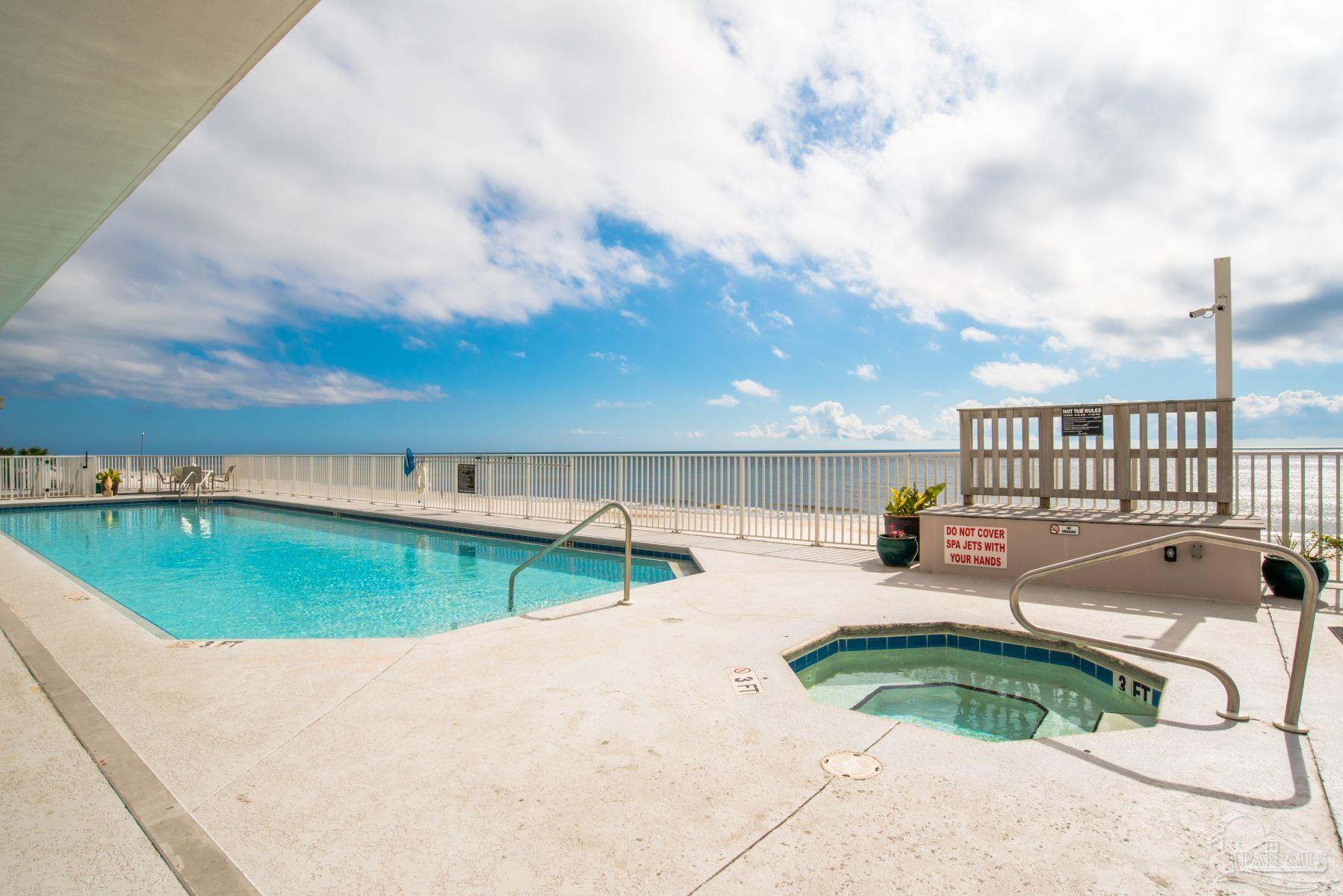 14511 Perdido Key Drive, Unit 1301 Perdido Key, FL 32507 - Photo 62 of 65 a view of a swimming pool with a patio and a yard