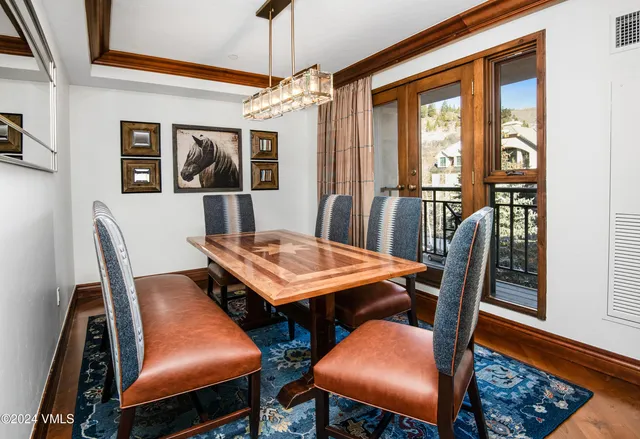 a view of a dining room with furniture window and wooden floor