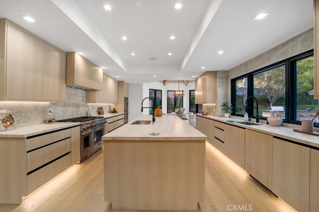 29269 Wagon Road Agoura Hills, CA 91301 - Photo 13 of 53 a large kitchen with stainless steel appliances lots of counter space and a sink