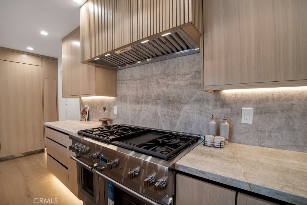 29269 Wagon Road Agoura Hills, CA 91301 - Photo 14 of 53 a stove top oven sitting inside of a kitchen