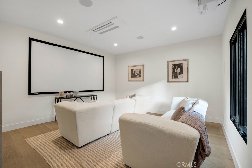 29269 Wagon Road Agoura Hills, CA 91301 - Photo 29 of 53 a living room with furniture and a flat screen tv