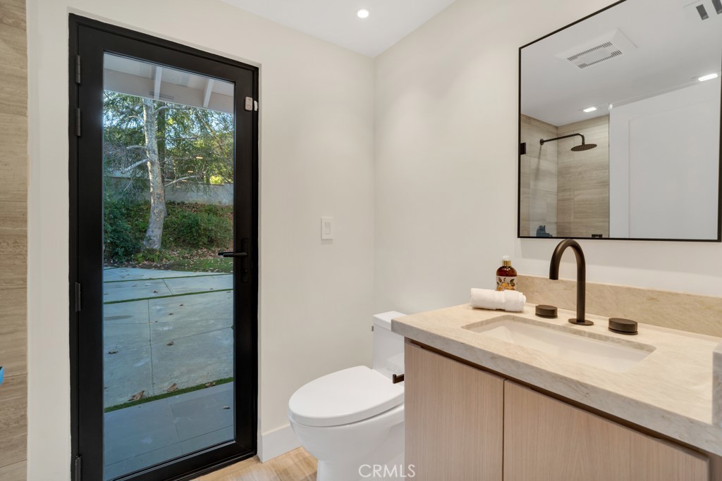 29269 Wagon Road Agoura Hills, CA 91301 - Photo 50 of 53 a bathroom with a granite countertop sink toilet and shower