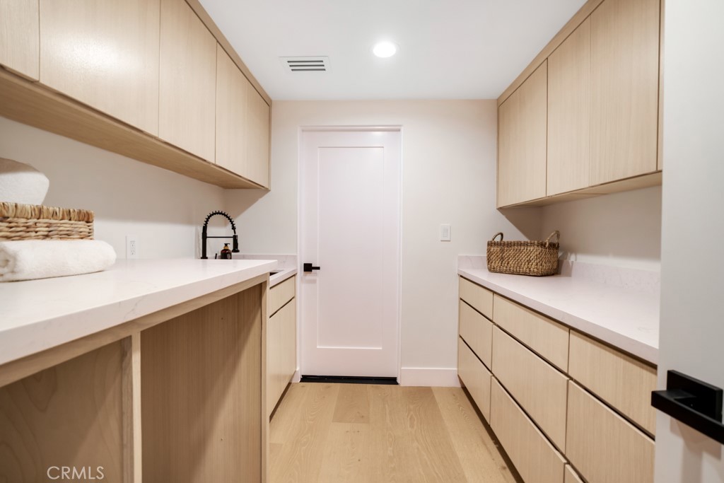 29269 Wagon Road Agoura Hills, CA 91301 - Photo 51 of 53 a kitchen with a sink and cabinets