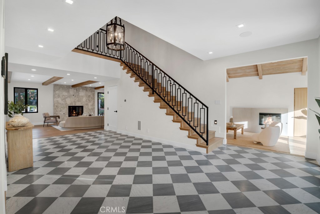 29269 Wagon Road Agoura Hills, CA 91301 - Photo 9 of 53 a view of a hallway with a black white checkered floor and a large mirror on a counter
