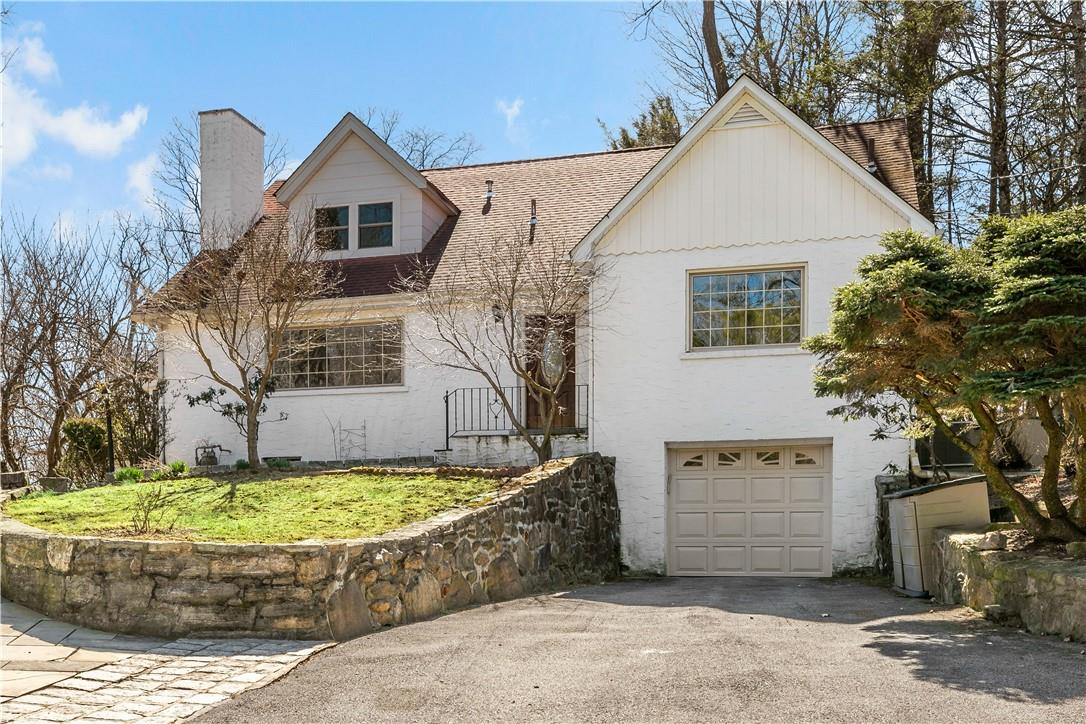 45 Stormytown Road Ossining, NY 10562 - Photo 1 of 1 a view of a white house with a small yard and large tree