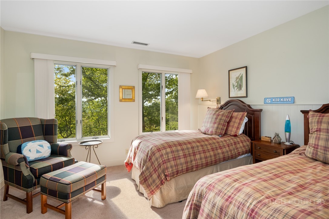 246 Mulberry Lane Boone, NC 28607 - Photo 45 of 49 a bedroom with two beds and a large window
