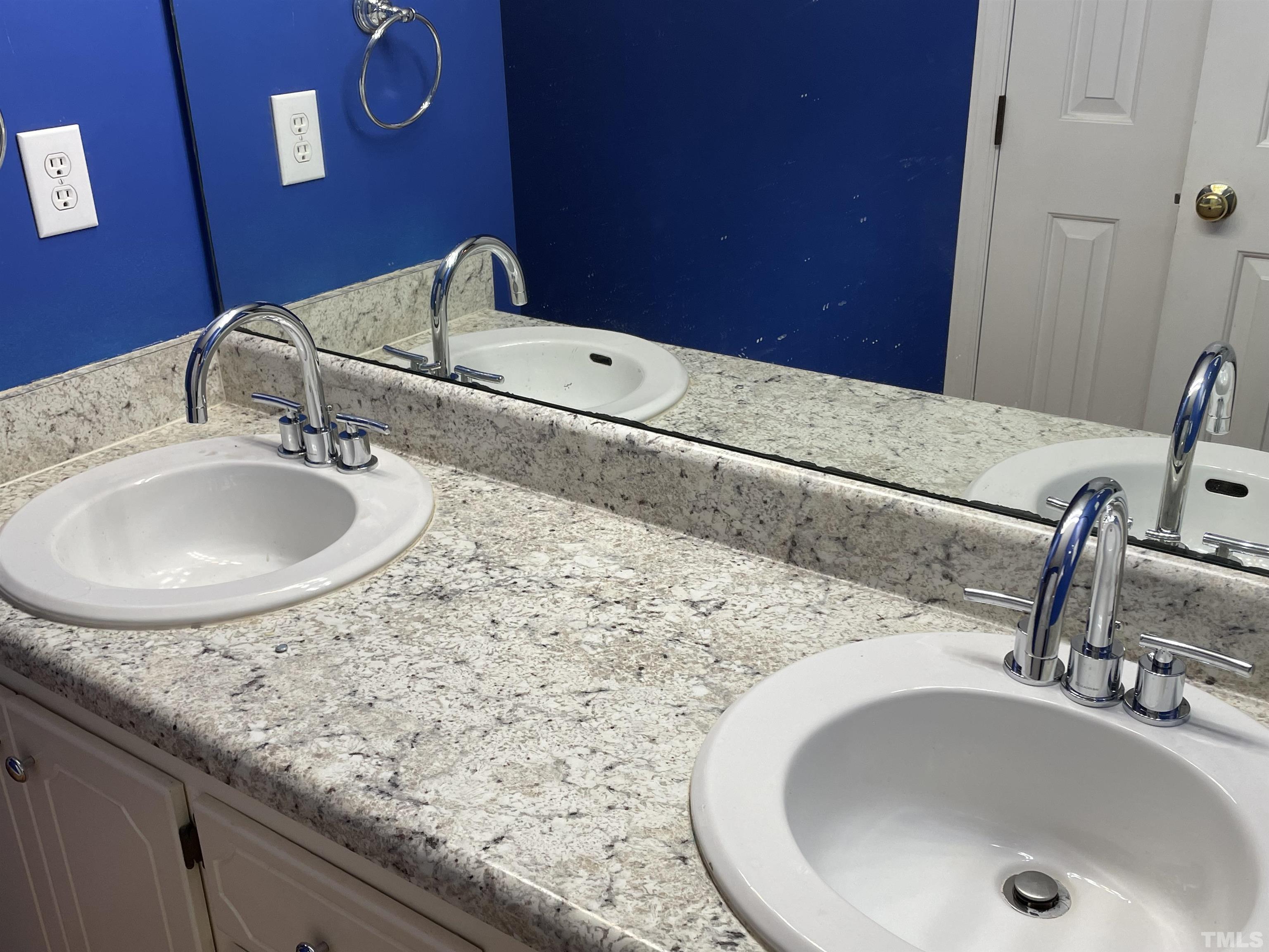 112 Windgate Court Raleigh, NC 27603 - Photo 8 of 10 a bathroom with a sink and a mirror