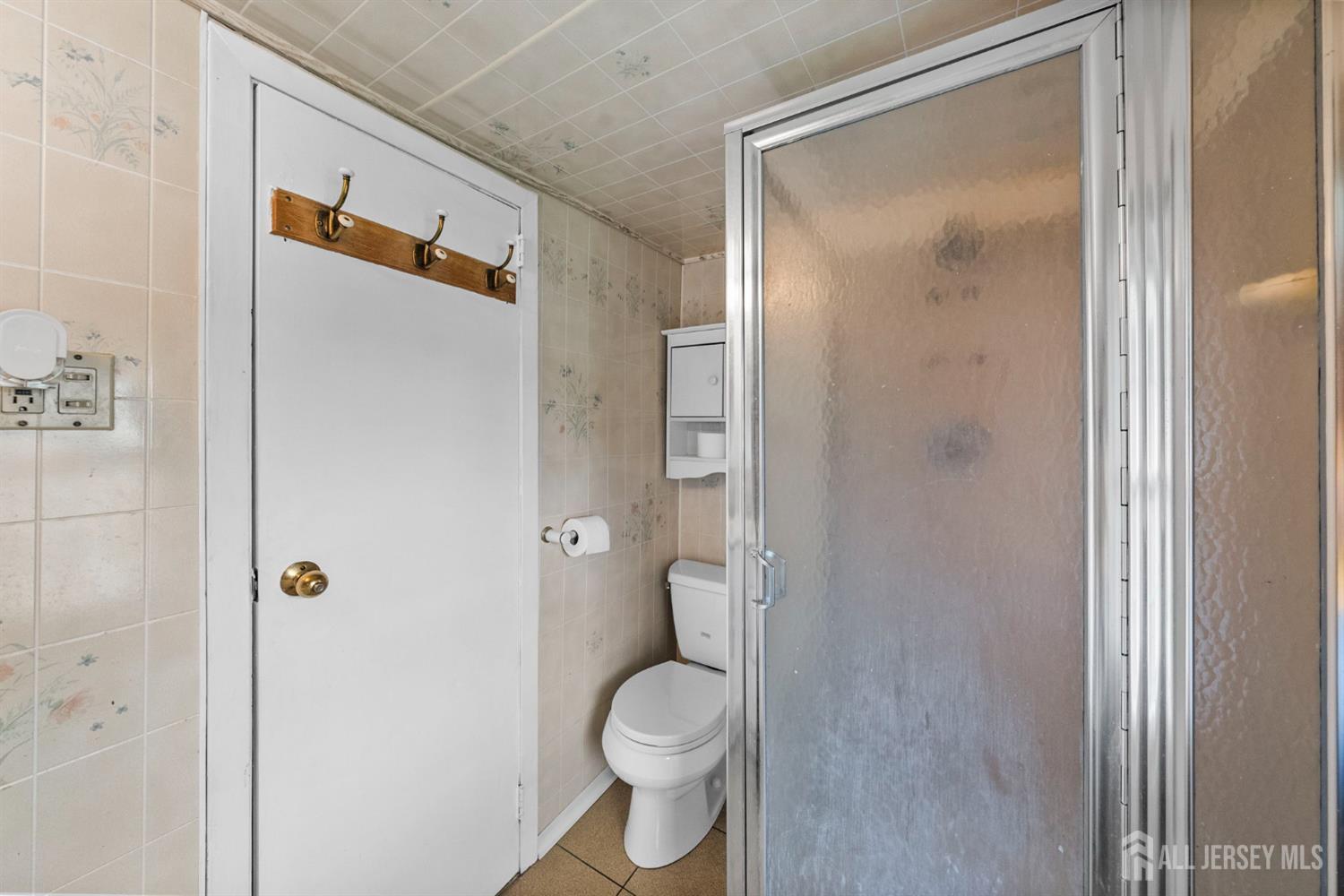 202 Ravine Drive Matawan, NJ 07747 - Photo 18 of 41 a bathroom with a granite countertop toilet and shower