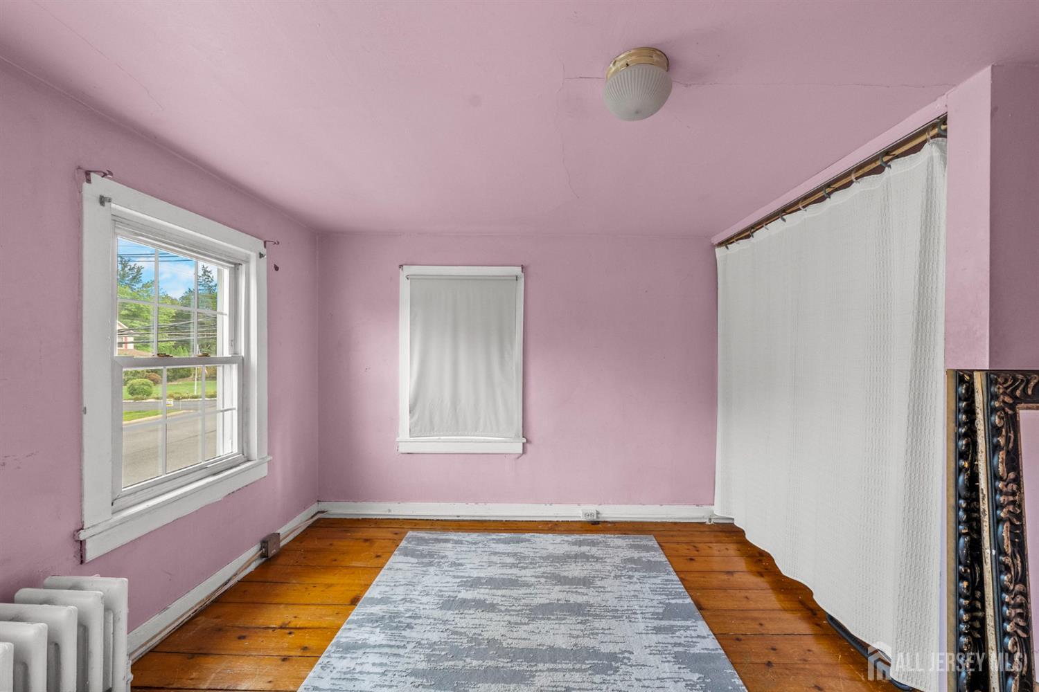 202 Ravine Drive Matawan, NJ 07747 - Photo 21 of 41 a view of an empty room with windows