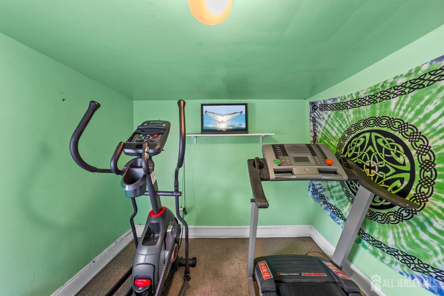 202 Ravine Drive Matawan, NJ 07747 - Photo 23 of 41 a view of a room with gym equipment
