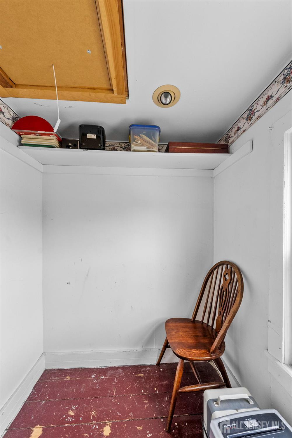 202 Ravine Drive Matawan, NJ 07747 - Photo 29 of 41 a room with a chair and couch