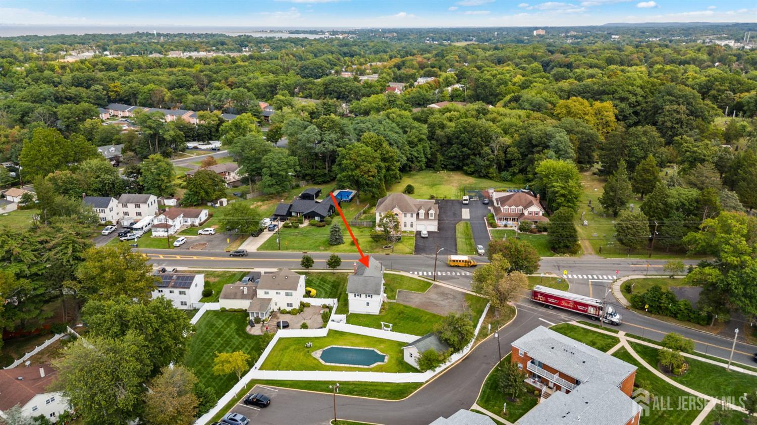 202 Ravine Drive Matawan, NJ 07747 - Photo 3 of 41 an aerial view of house with yard swimming pool and mountain view in back