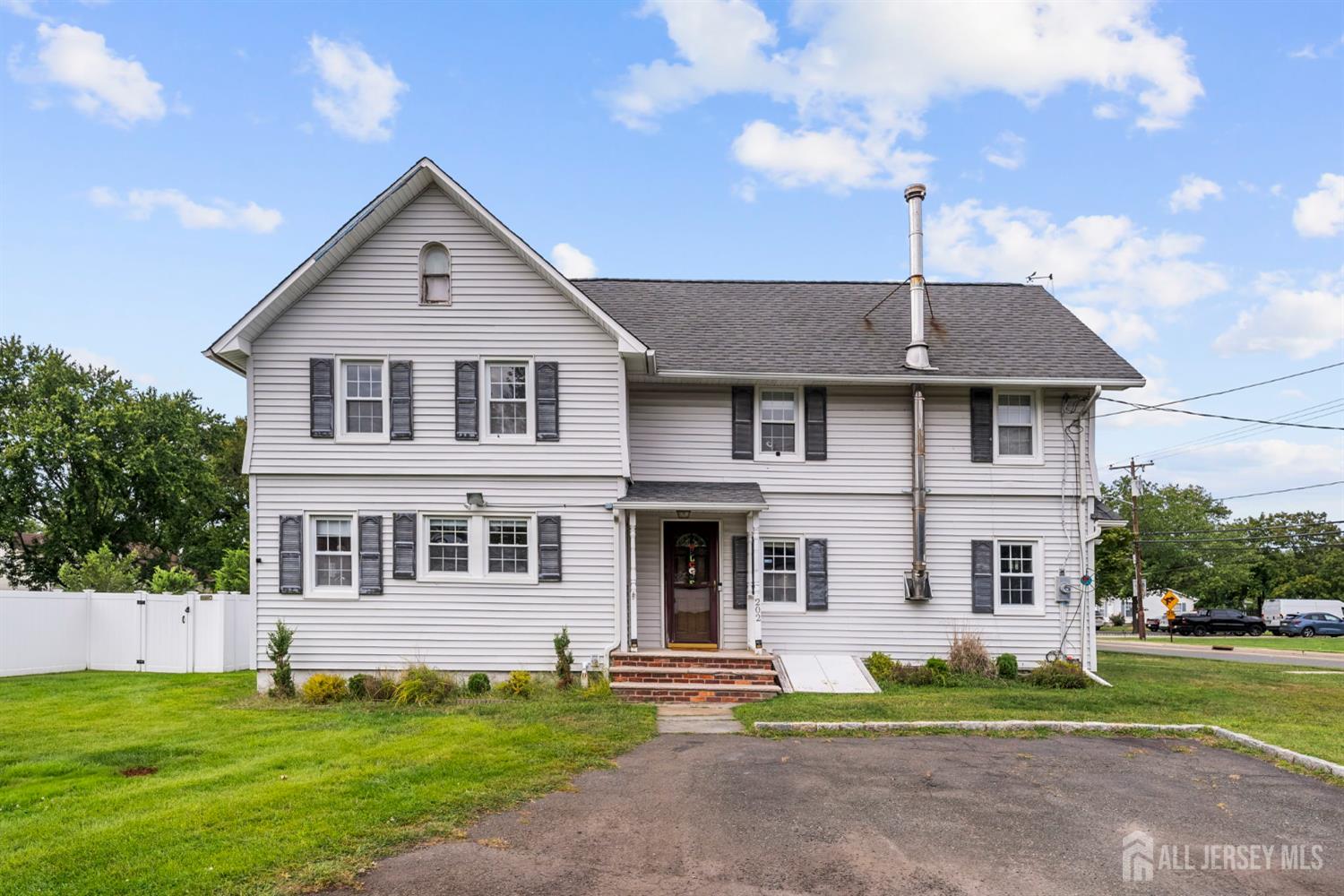 202 Ravine Drive Matawan, NJ 07747 - Photo 31 of 41 a front view of a house with a yard