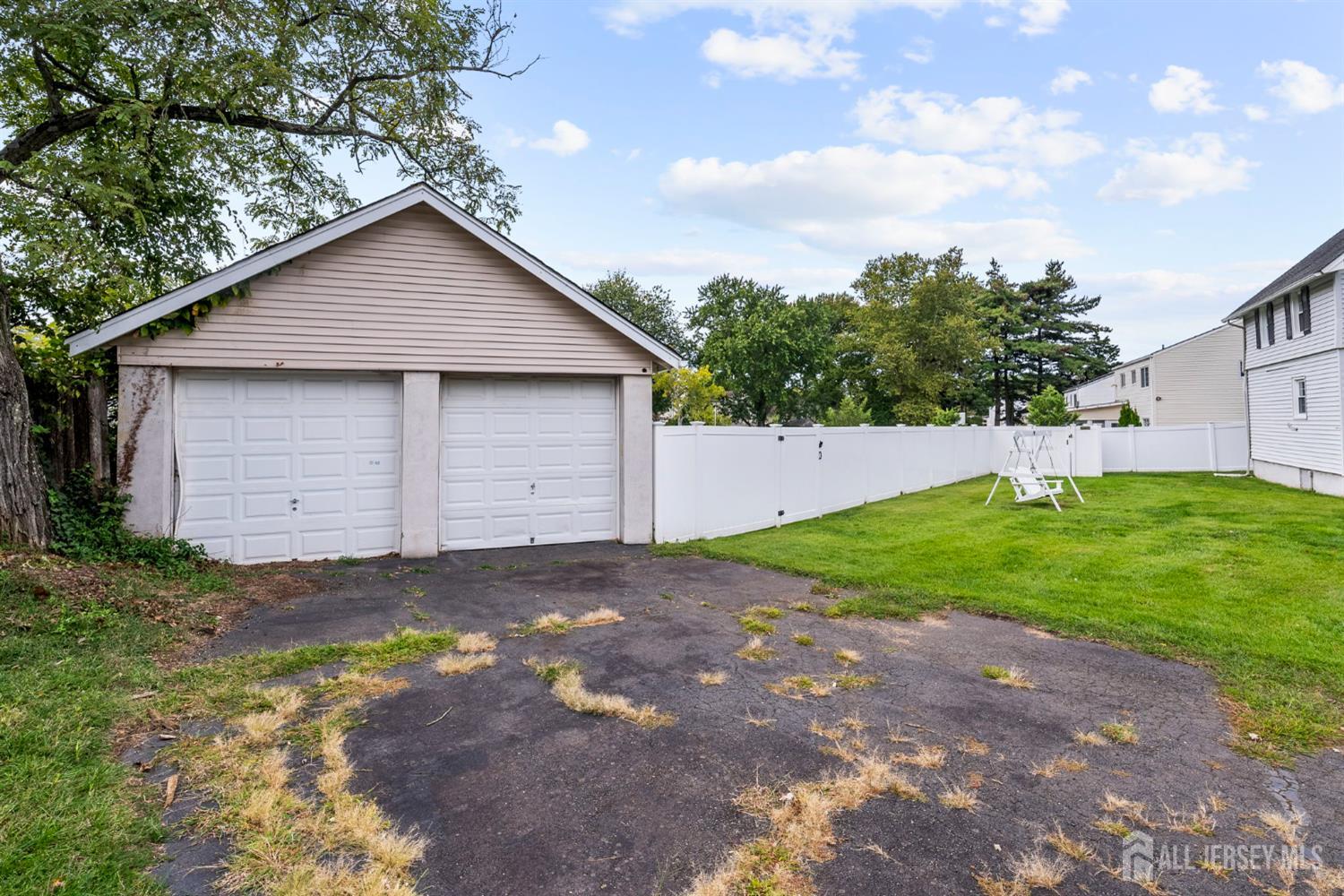 202 Ravine Drive Matawan, NJ 07747 - Photo 32 of 41 a backyard of house with garage and a garage