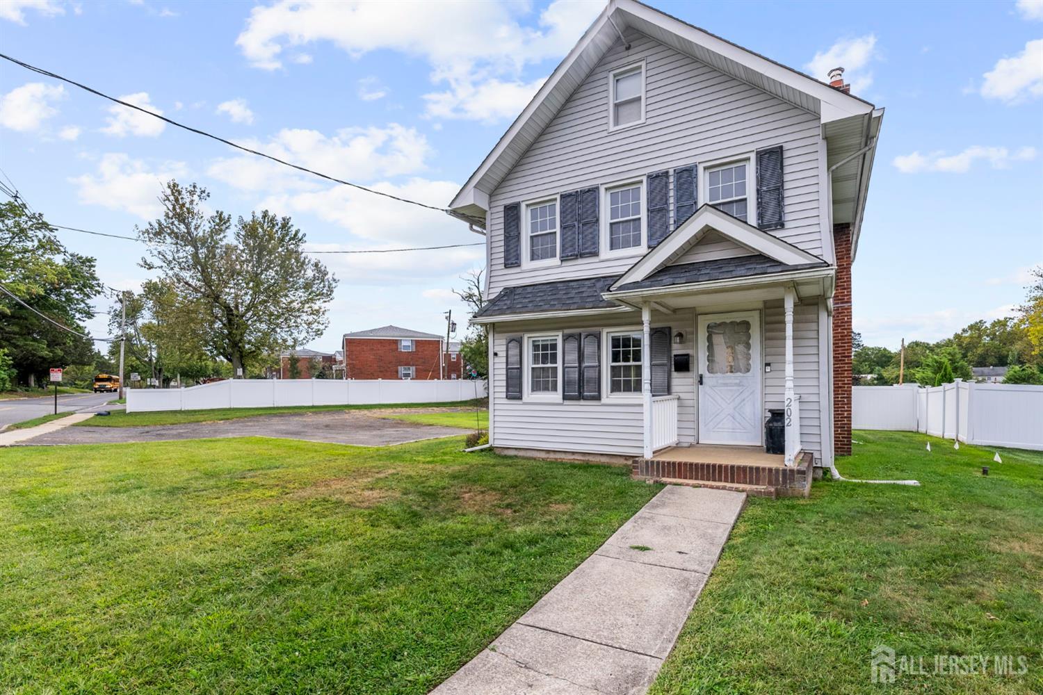 202 Ravine Drive Matawan, NJ 07747 - Photo 36 of 41 a front view of a house with yard