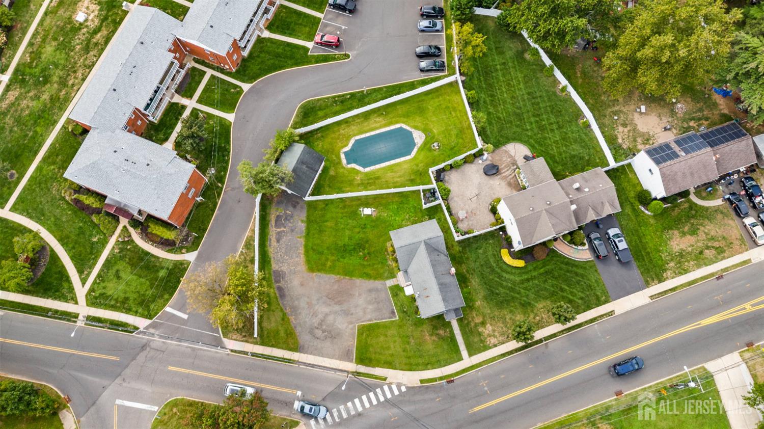 202 Ravine Drive Matawan, NJ 07747 - Photo 41 of 41 an aerial view of a house with a garden and swimming pool