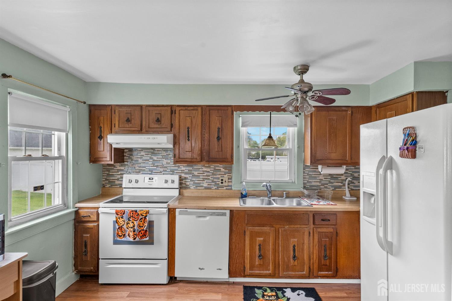 202 Ravine Drive Matawan, NJ 07747 - Photo 8 of 41 a kitchen with stainless steel appliances granite countertop a refrigerator and a stove