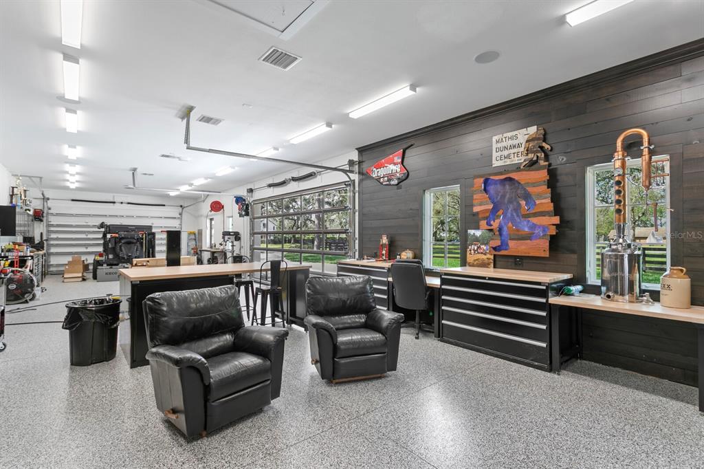 10101 Tarpon Springs Road Odessa, FL 33556 - Photo 16 of 53 a living room with furniture and a flat screen tv