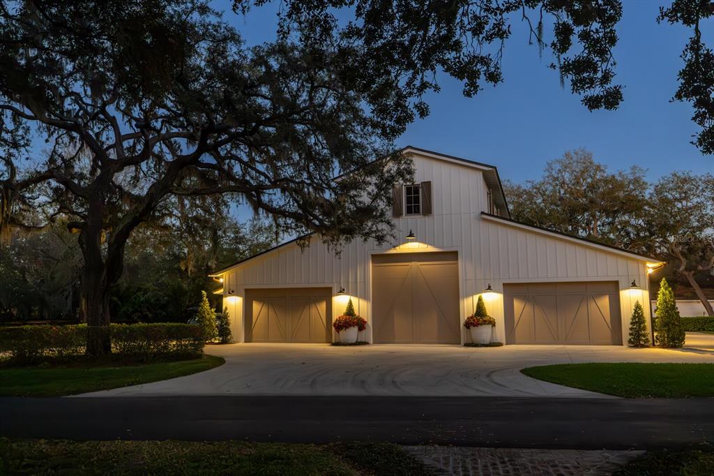 10101 Tarpon Springs Road Odessa, FL 33556 - Photo 46 of 53 a front view of a house with a yard and garage