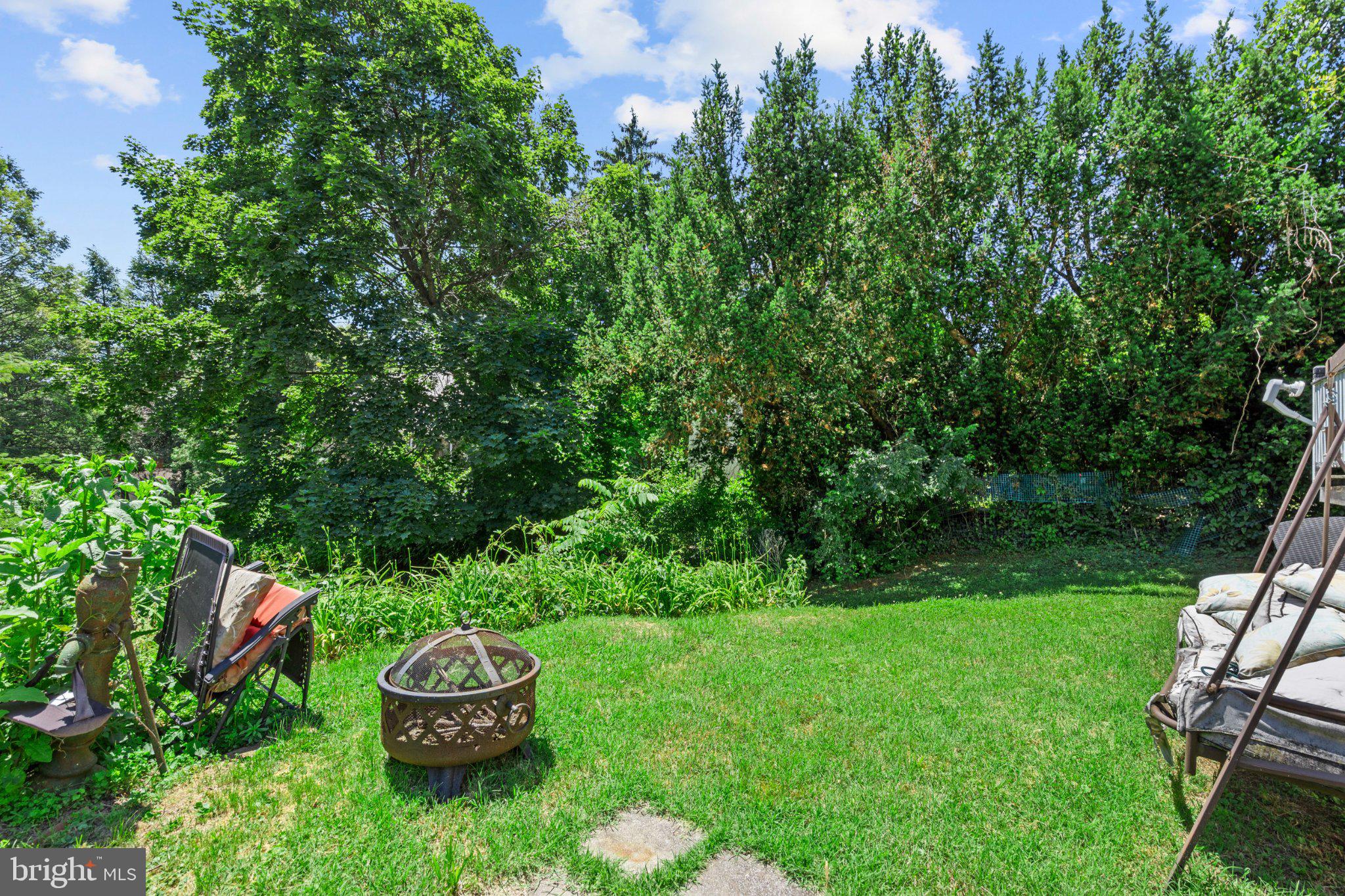 242 Church Road Elkins Park, PA 19027 - Photo 27 of 29 Lush backyard oasis with fire pit.